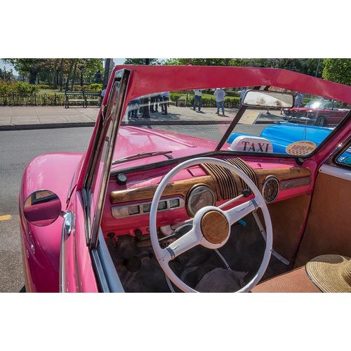 View into drivers seat of classic convertible pink American car parked in Vieja-Havana-Cuba